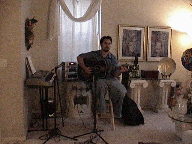 Full shot of Mike and guitar, 7-15-03.